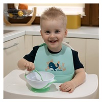 Adjustable baby silicone bib with pocket Akuku whale mint